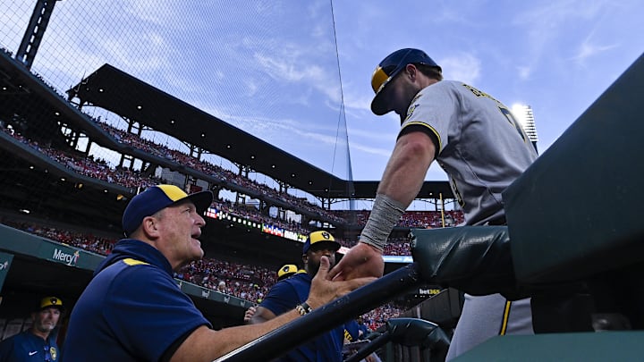 Sep 20, 2025; St. Louis, Missouri, USA; Milwaukee Brewers left fielder Jake Bauers (9) is congratulated by manager Pat Murphy (49) after scoring against the St. Louis Cardinals during the second inning at Busch Stadium. Mandatory Credit: Jeff Curry-Imagn Images