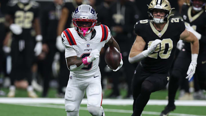 Oct 12, 2025; New Orleans, Louisiana, USA; New England Patriots wide receiver Demario Douglas (3) runs for a gain past New Orleans Saints linebacker Pete Werner (20) during the first quarter at Caesars Superdome. Mandatory Credit: Stephen Lew-Imagn Images