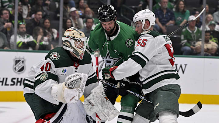 Sep 23, 2025; Dallas, Texas, USA; Minnesota Wild goaltender Cal Petersen (40) and defenseman David Jiricek (55) and Dallas Stars left wing Jamie Benn (14) in action during the game between the Dallas Stars and the Minnesota Wild at American Airlines Center. Mandatory Credit: Jerome Miron-Imagn Images
