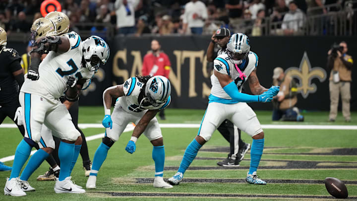 Dec 14, 2025; New Orleans, Louisiana, USA; Carolina Panthers running back Rico Dowdle (5) and teammates celebrate at the end zone after scoring a touchdown against the New Orleans Saints during the first quarter at Caesars Superdome. Mandatory Credit: Matthew Hinton-Imagn Images Dec 14, 2025; New Orleans, Louisiana, USA; Carolina Panthers running back Rico Dowdle (5) and teammates celebrate at the end zone after scoring a touchdown against the New Orleans Saints during the first quarter at Caesars Superdome. Mandatory Credit: Matthew Hinton-Imagn Images