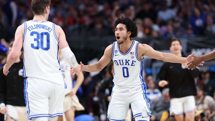 Mar 31, 2024; Dallas, TX, USA; Duke Blue Devils guard Jared McCain (0) and center Kyle Filipowski (30) react in the first half against the North Carolina State Wolfpack in the finals of the South Regional of the 2024 NCAA Tournament at American Airline Center. Mandatory Credit: Kevin Jairaj-Imagn Images