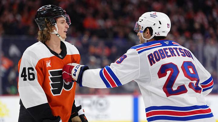 Jan 17, 2026; Philadelphia, Pennsylvania, USA; New York Rangers defenseman Matthew Robertson (29) hits Philadelphia Flyers center Trevor Zegras (46) in the third period at Xfinity Mobile Arena. Mandatory Credit: Kyle Ross-Imagn Images