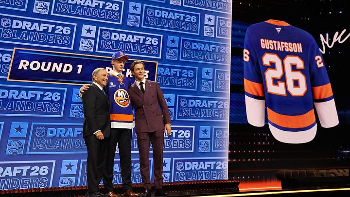 Jun 26, 2026; Buffalo, New York, USA; Malte Gustafsson reacts beside NHL commissioner Gary Bettman and New York Islanders player Matthew Schaefer after being selected with the thirteenth pick in the first round of the 2026 NHL Draft by the Islanders at KeyBank Center. Mandatory Credit: Timothy T. Ludwig-Imagn Images