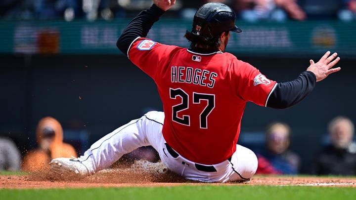 Apr 19, 2026; Cleveland, Ohio, USA; Cleveland Guardians catcher Austin Hedges (27) scores a run on a sacrifice fly by Cleveland Guardians left fielder Steven Kwan (38) during the third inning against the Baltimore Orioles at Progressive Field. Mandatory Credit: David Dermer-Imagn Images