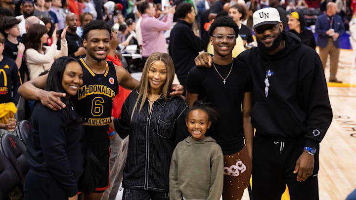 Mar 28, 2023; Houston, TX, USA; West guard Bronny James (6) poses for a family photo with grandmother Gloria Marie James, mother Savannah James , brother Bryce Maximus James, sister Zhuri Nova James and father LeBron James following the McDonald's All American Boy's high school basketball game at Toyota Center. Mandatory Credit: Mark J. Rebilas-Imagn Images Mar 28, 2023; Houston, TX, USA; West guard Bronny James (6) poses for a family photo with grandmother Gloria Marie James, mother Savannah James , brother Bryce Maximus James, sister Zhuri Nova James and father LeBron James following the McDonald's All American Boy's high school basketball game at Toyota Center. Mandatory Credit: Mark J. Rebilas-Imagn Images