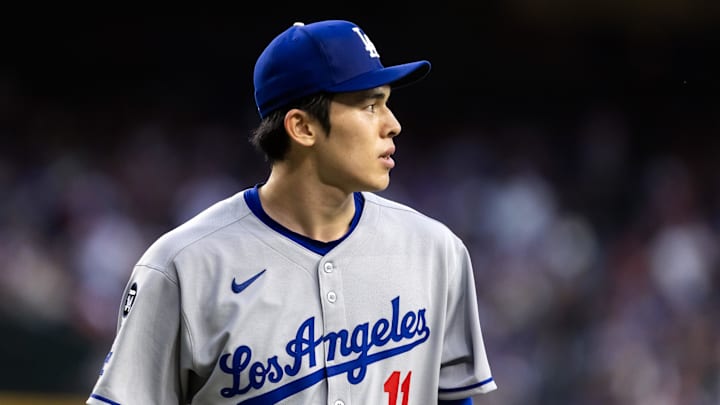 May 9, 2025; Phoenix, Arizona, USA; Los Angeles Dodgers pitcher Roki Sasaki (11) against the Arizona Diamondbacks at Chase Field. Mandatory Credit: Mark J. Rebilas-Imagn Images