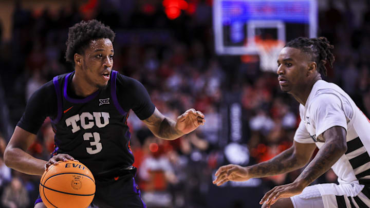Feb 22, 2025; Cincinnati, Ohio, USA; TCU Horned Frogs guard Vasean Allette (3) dribbles against Cincinnati Bearcats guard Jizzle James (2) in the second half at Fifth Third Arena. Mandatory Credit: Katie Stratman-Imagn Images