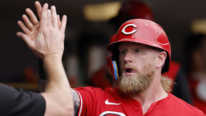 Jun 14, 2025; Detroit, Michigan, USA;  Cincinnati Reds outfielder Jake Fraley (27) receives congratulations from teammates after scoring in the fifth inning against the Detroit Tigers at Comerica Park. Mandatory Credit: Rick Osentoski-Imagn Images