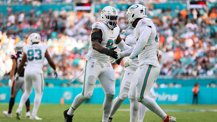 Miami Dolphins linebacker Emmanuel Ogbah (91) celebrates with linebacker Chop Robinson (44) after a play against the New England Patriots during the second quarter at Hard Rock Stadium. Miami Dolphins linebacker Emmanuel Ogbah (91) celebrates with linebacker Chop Robinson (44) after a play against the New England Patriots during the second quarter at Hard Rock Stadium.