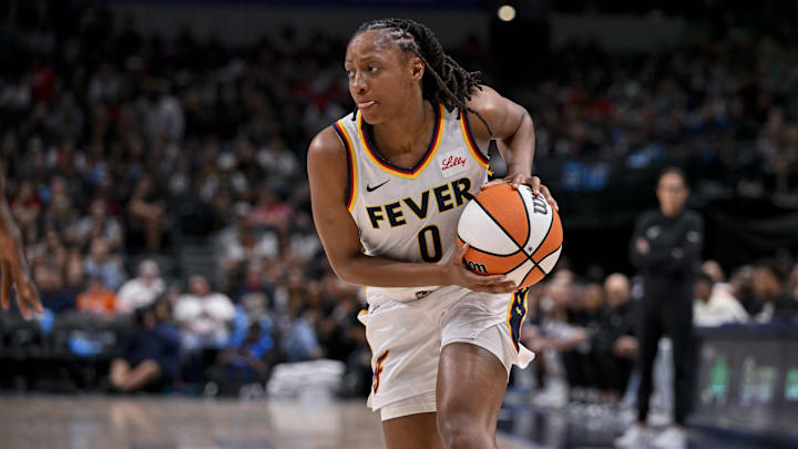 Aug 1, 2025; Dallas, Texas, USA; Indiana Fever guard Kelsey Mitchell (0) in action during the game between the Dallas Wings and the Indiana Fever at the American Airlines Center. Mandatory Credit: Jerome Miron-Imagn Images