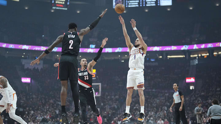 Feb 1, 2025; Portland, Oregon, USA; Phoenix Suns shooting guard Devin Booker (1) shoots the ball over Portland Trail Blazers center Deandre Ayton (2) and forward Toumani Camara (33) during the first half at Moda Center. Mandatory Credit: Soobum Im-Imagn Images Feb 1, 2025; Portland, Oregon, USA; Phoenix Suns shooting guard Devin Booker (1) shoots the ball over Portland Trail Blazers center Deandre Ayton (2) and forward Toumani Camara (33) during the first half at Moda Center. Mandatory Credit: Soobum Im-Imagn Images