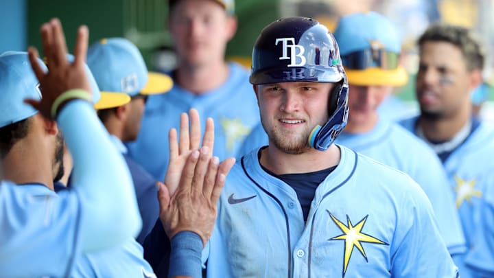 Clearwater, Florida, USA; Tampa Bay Rays second base Curtis Mead (25) is congratulated after he scored a run during the fifth inning against the Philadelphia Phillies at BayCare Ballpark. Clearwater, Florida, USA; Tampa Bay Rays second base Curtis Mead (25) is congratulated after he scored a run during the fifth inning against the Philadelphia Phillies at BayCare Ballpark.