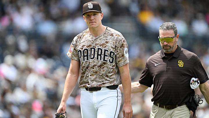 Apr 12, 2026; San Diego, California, USA; San Diego Padres starting pitcher Nick Pivetta (27), left, leaves the field with a trainer during the fourth inning against the Colorado Rockies at Petco Park. Mandatory Credit: Denis Poroy-Imagn Images Apr 12, 2026; San Diego, California, USA; San Diego Padres starting pitcher Nick Pivetta (27), left, leaves the field with a trainer during the fourth inning against the Colorado Rockies at Petco Park. Mandatory Credit: Denis Poroy-Imagn Images