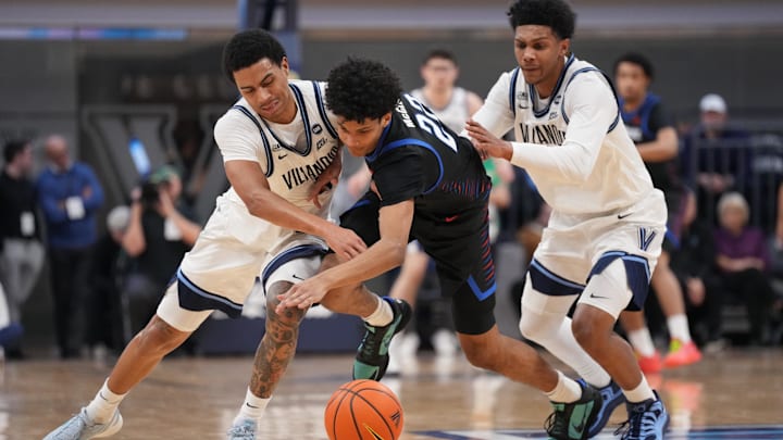 Dec 31, 2025; Villanova, Pennsylvania, USA; Villanova Wildcats guard Bryce Lindsay (2) and guard Acaden Lewis (55) battle for the ball against DePaul Blue Demons guard Kruz McClure (22) in the first half at William B. Finneran Pavilion. Mandatory Credit: Kyle Ross-Imagn Images Dec 31, 2025; Villanova, Pennsylvania, USA; Villanova Wildcats guard Bryce Lindsay (2) and guard Acaden Lewis (55) battle for the ball against DePaul Blue Demons guard Kruz McClure (22) in the first half at William B. Finneran Pavilion. Mandatory Credit: Kyle Ross-Imagn Images