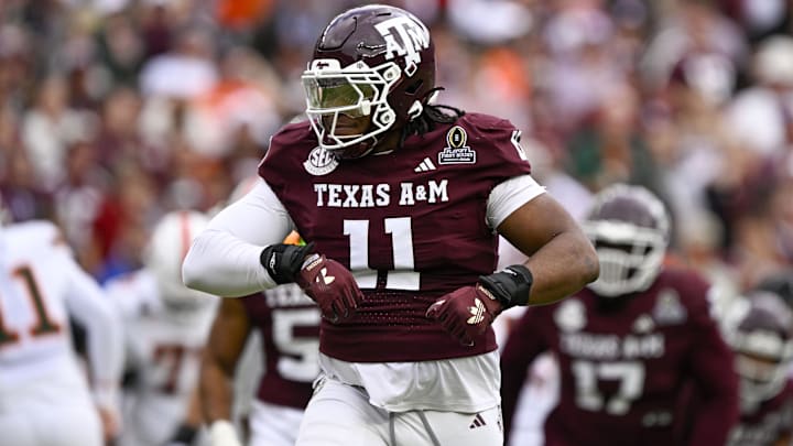 Dec 20, 2025; College Station, TX, USA; Texas A&M Aggies defensive tackle Tyler Onyedim (11) celebrates during the game between the Aggies and the Hurricanes at Kyle Field. 