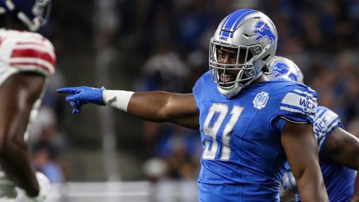 Former UW defensive tackles Levi Onwuzurike celebrates a preseason play for the Detroit Lions in 2023.