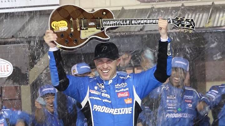 Denny Hamlin holds up the trophy, a Gibson Guitar, after winning Sunday's NASCAR Cup Series Cracker Barrel 400 at Nashville Superspeedway. Denny Hamlin holds up the trophy, a Gibson Guitar, after winning Sunday's NASCAR Cup Series Cracker Barrel 400 at Nashville Superspeedway.