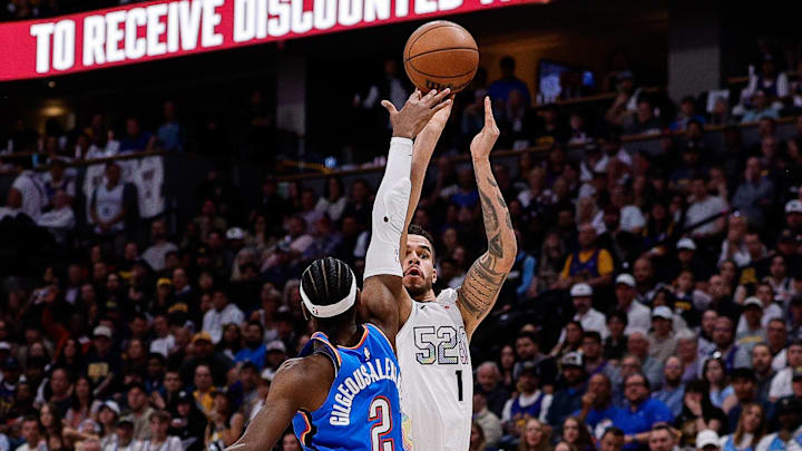 May 15, 2025; Denver, Colorado, USA; Denver Nuggets forward Michael Porter Jr. (1) attempts a shot as Oklahoma City Thunder guard Shai Gilgeous-Alexander (2) defends in the third quarter during game six of the second round for the 2025 NBA Playoffs at Ball Arena. Mandatory Credit: Isaiah J. Downing-Imagn Images