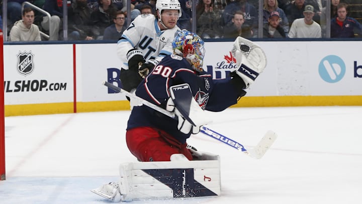 Blue Jackets goaltender Elvis Merzlikins makes a glove save against the Utah Mammoth.