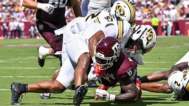 Oct 5, 2024; College Station, Texas, USA;  Texas A&M Aggies running back Le'Veon Moss (8) scores a touchdown in the second quarter against the Missouri Tigers at Kyle Field. Mandatory Credit: Maria Lysaker-Imagn Images. 