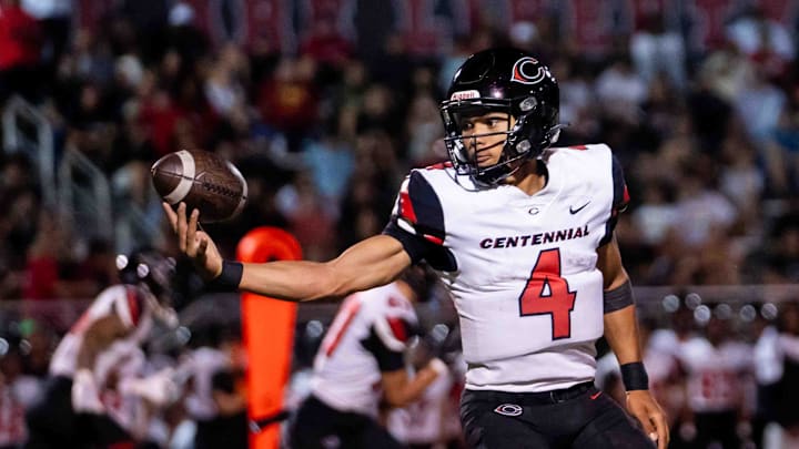 Centennial Huskies Quarterback Husan Longstreet (4) catches the ball at Liberty High School on Sept. 21, 2024, in Peoria.