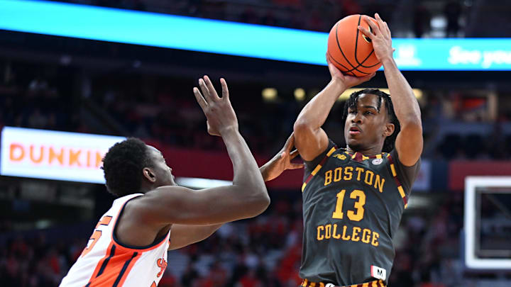 Jan 10, 2024; Syracuse, New York, USA; Boston College Eagles guard Donald Hand Jr. (13) shoots the ball over Syracuse Orange center Mounir Hima (55) in the first half at the JMA Wireless Dome. Mandatory Credit: Mark Konezny-Imagn Images Jan 10, 2024; Syracuse, New York, USA; Boston College Eagles guard Donald Hand Jr. (13) shoots the ball over Syracuse Orange center Mounir Hima (55) in the first half at the JMA Wireless Dome. Mandatory Credit: Mark Konezny-Imagn Images