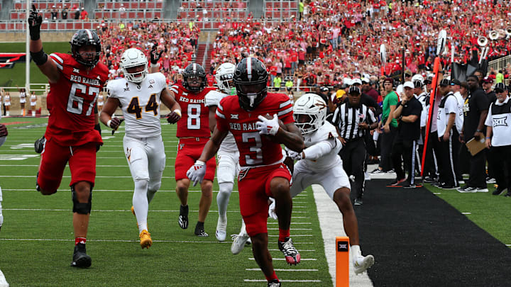 Sep 21, 2024; Lubbock, Texas, USA;  Texas Tech Red Raiders wide receiver Josh Kelly (3) scores a touchdown against Arizona State Sun Devils defensive safety Myles Rowser (4) in the first half at Jones AT&T Stadium and Cody Campbell Field. Mandatory Credit: Michael C. Johnson-Imagn Images