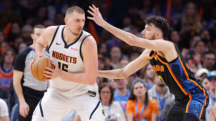 Oklahoma City Thunder forward Chet Holmgren (7) defends Denver Nuggets center Nikola Jokic (15) during the second half at Paycom Center. Mandatory Credit: Alonzo Adams-Imagn Images
