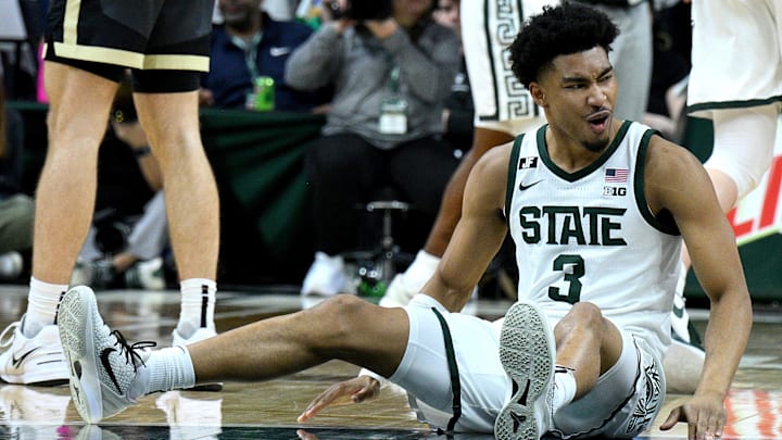 Feb 18, 2025; East Lansing, Michigan, USA;  Michigan State Spartans guard Jaden Akins (3) celebrates after a Purdue Boilermakers foul that knocked him to the floor during the second half at Jack Breslin Student Events Center. Mandatory Credit: Dale Young-Imagn Images