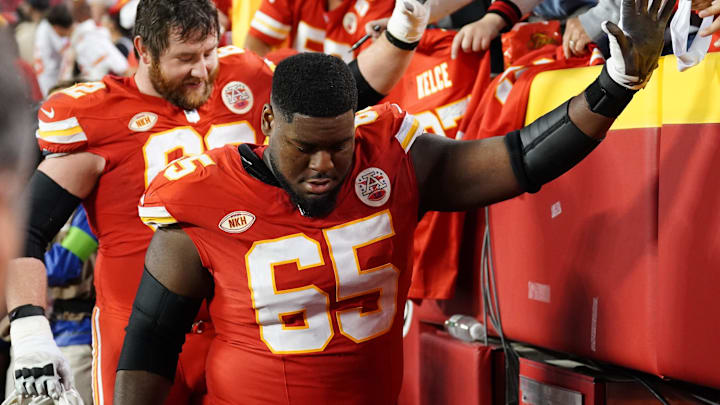 Oct 12, 2023; Kansas City, Missouri, USA; Kansas City Chiefs guard Trey Smith (65) high fives fans after the game against the Denver Broncos at GEHA Field at Arrowhead Stadium. Mandatory Credit: Denny Medley-Imagn Images