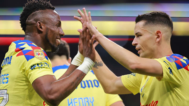 América's Julián Quiñones (left) and Álvaro Fidalgo had plenty to celebrate on Saturday night at Estadio Azteca. The defending Liga MX champs routed Toluca 5-1 to return to the top of the table.