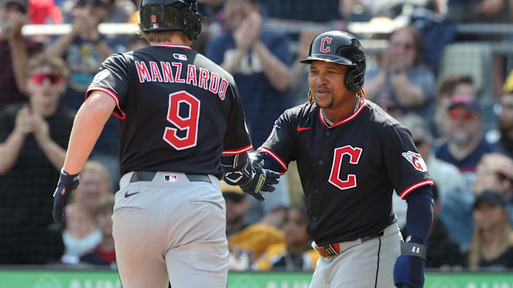 Apr 20, 2025; Pittsburgh, Pennsylvania, USA;  Cleveland Guardians third baseman Jose Ramirez (11) greets first baseman Kyle Manzardo (9) crossing home plate on a two run home run against the Pittsburgh Pirates during the seventh inning at PNC Park. Mandatory Credit: Charles LeClaire-Imagn Images