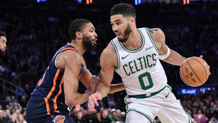 Apr 8, 2025; New York, New York, USA; Boston Celtics forward Jayson Tatum (0) drives to the basket while being defended by New York Knicks forward Mikal Bridges (25) during the second half at Madison Square Garden. Mandatory Credit: John Jones-Imagn Images