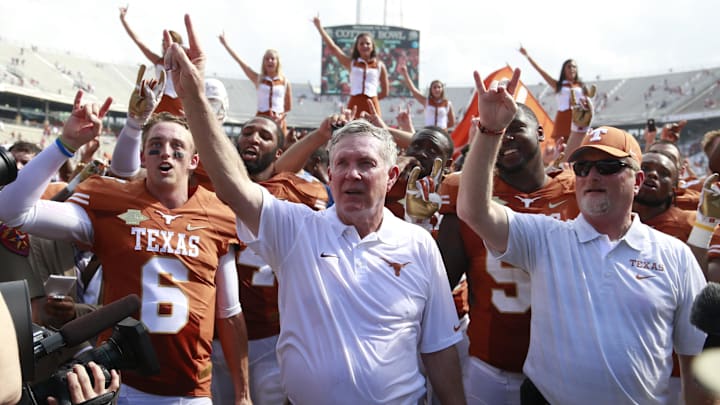Oct 12, 2013; Dallas, TX, USA;  Texas Longhorns head coach Mack Brown celebrates winning the game against the Oklahoma Sooners after the Red River Rivalry at Cotton Bowl Stadium. The Texas Longhorns beat the Oklahoma Sooners 36-20. Mandatory Credit: Tim Heitman-Imagn Images