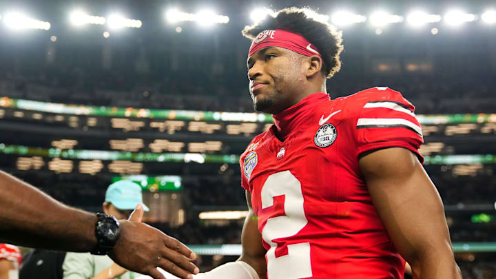 Ohio State Buckeyes defensive back Caleb Downs (2) leaves the field following the Cotton Bowl at AT&T Stadium in Arlington, Texas for the College Football Playoff quarterfinal game against the Miami Hurricanes on Dec. 31, 2025. Ohio State lost 24-14.