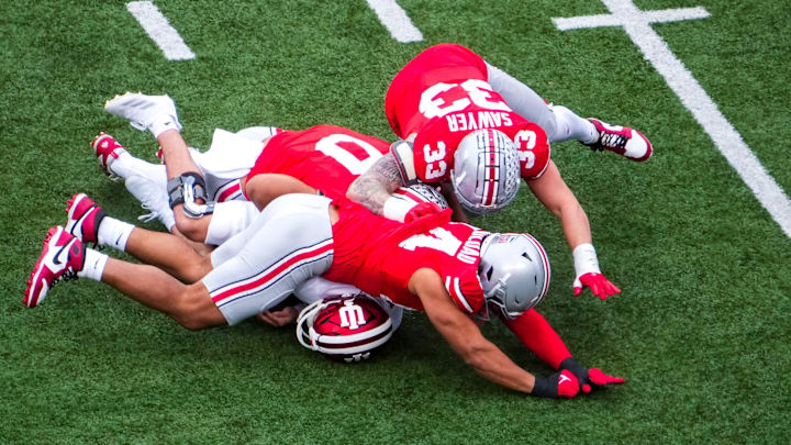 Indiana Hoosiers quarterback Kurtis Rourke (9) is sacked by the Ohio State Buckeye defense in the second quarter at Ohio Stadium on Saturday, Nov. 23, 2024 in Columbus, Ohio.
