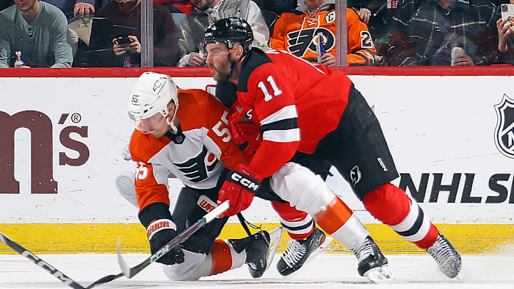 Stefan Noesen (Devils #11) wrestling Rasmus Ristolainen (Flyers #55)