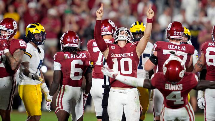 Oklahoma Sooners quarterback John Mateer (10) celebrates after a college football game between the University of Oklahoma Sooners (OU) and the University of Michigan Wolverines at Gaylord Family Ð Oklahoma Memorial Stadium in Norman, Okla., Saturday, Sept. 6, 2025. Oklahoma won 24-13. Oklahoma Sooners quarterback John Mateer (10) celebrates after a college football game between the University of Oklahoma Sooners (OU) and the University of Michigan Wolverines at Gaylord Family Ð Oklahoma Memorial Stadium in Norman, Okla., Saturday, Sept. 6, 2025. Oklahoma won 24-13.