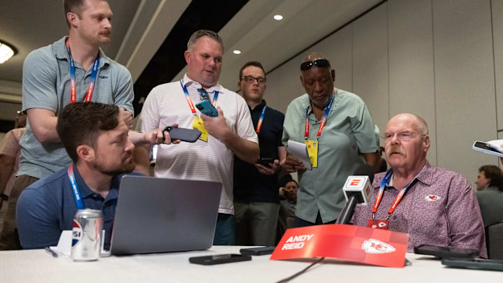 Mar 31, 2026; Phoenix, AZ, USA; Kansas City Chiefs head coach Andy Reid (right) speaks to reporters in the media during the 2026 NFL Annual League Meeting at the Arizona Biltmore. Mandatory Credit: Mark J. Rebilas-Imagn Images