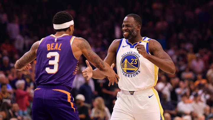 Apr 8, 2025; Phoenix, Arizona, USA; Golden State Warriors forward Draymond Green (23) greets Phoenix Suns guard Bradley Beal (3) at Footprint Center. Mandatory Credit: Mark J. Rebilas-Imagn Images