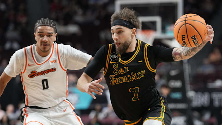 March 8, 2026; Las Vegas, NV, USA; San Francisco Dons guard Vukasin Masic (7) dribbles the basketball against Oregon State Beavers guard Dez White (0) during the first half at Orleans Arena. Mandatory Credit: Kyle Terada-Imagn Images March 8, 2026; Las Vegas, NV, USA; San Francisco Dons guard Vukasin Masic (7) dribbles the basketball against Oregon State Beavers guard Dez White (0) during the first half at Orleans Arena. Mandatory Credit: Kyle Terada-Imagn Images