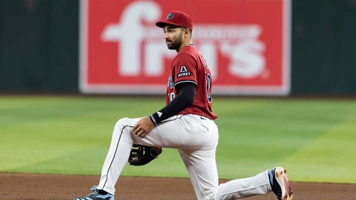 May 28, 2025; Phoenix, Arizona, USA; Arizona Diamondbacks second baseman Jordan Lawlar reacts after make a throwing error in the sixth inning against the Pittsburgh Pirates at Chase Field. Mandatory Credit: Mark J. Rebilas-Imagn Images