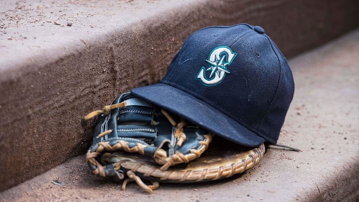 Aug 18, 2015; Arlington, TX, USA; A view of a Seattle Mariners ball cap and glove during the game between the Texas Rangers and the Seattle Mariners at Globe Life Park in Arlington. The Mariners defeat the Rangers 3-2. Mandatory Credit: Jerome Miron-Imagn Images