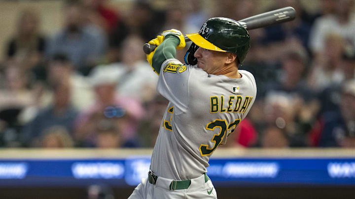 Aug 19, 2025; Minneapolis, Minnesota, USA; Athletics right fielder JJ Bleday (33) hits a double against the Minnesota Twins in the ninth inning at Target Field. Mandatory Credit: Jesse Johnson-Imagn Images
