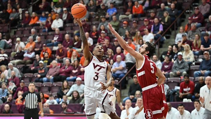 Jan 7, 2026; Blacksburg, Virginia, USA;  Virginia Tech Hokies guard Ben Hammond (3) shoots a shot as Stanford Cardinal guard Benny Gealer (5) defends during the first half at Cassell Coliseum. Mandatory Credit: Brian Bishop-Imagn Images