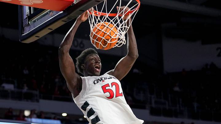 Cincinnati Bearcats center Moustapha Thiam (52) dunks in the first half of the NCAA men’s basketball game between the Cincinnati Bearcats and the NJIT Highlanders at Fifth Third Arena in Cincinnati on Monday, Nov. 24, 2025.