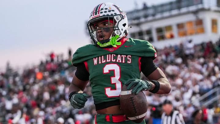 Lawrence North Wildcats running back Izayveon Moore (3) scores a touchdown.