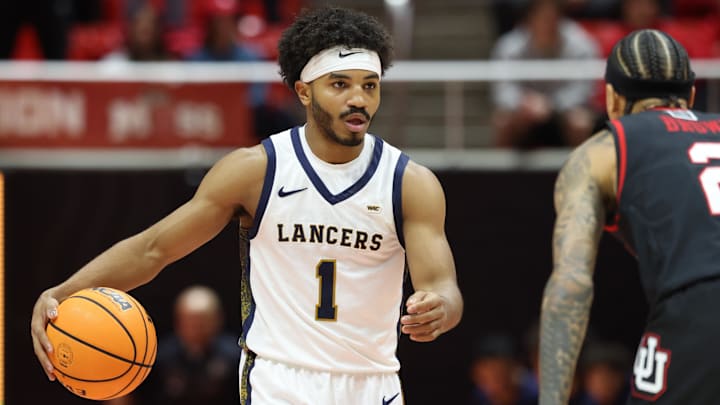California Baptist Lancers guard Dominique Daniels Jr. (1) dribbles against the Utah Utes at the Jon M. Huntsman Center. California Baptist Lancers guard Dominique Daniels Jr. (1) dribbles against the Utah Utes at the Jon M. Huntsman Center.