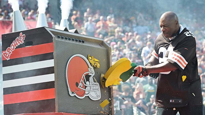 Sep 21, 2025; Cleveland, Ohio, USA; Former Cleveland Browns player Hanford Dixon breaks a Green Bay Packers guitar before the game between the Browns and the Packers at Huntington Bank Field. Mandatory Credit: Ken Blaze-Imagn Images