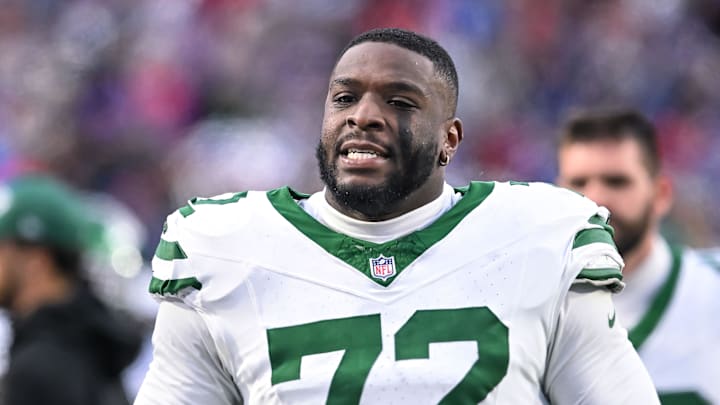 Dec 29, 2024; Orchard Park, New York, USA; New York Jets defensive end Micheal Clemons (72) on the sideline in the fourth quarter game against the Buffalo Bills at Highmark Stadium. Mandatory Credit: Mark Konezny-Imagn Images